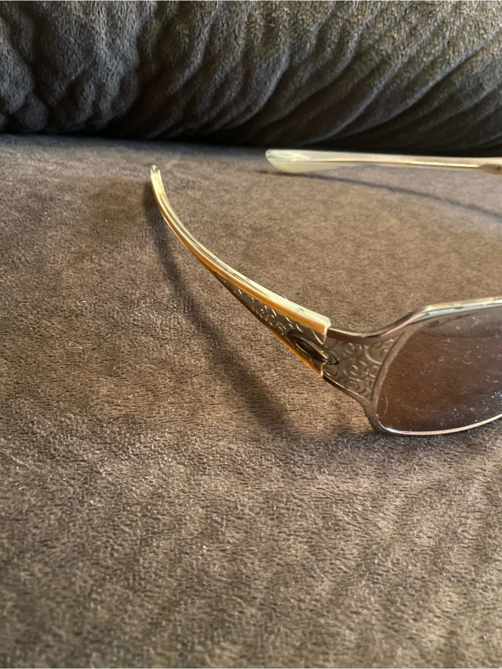 Oakley Silver Frame Sunglasses with Brown Lenses